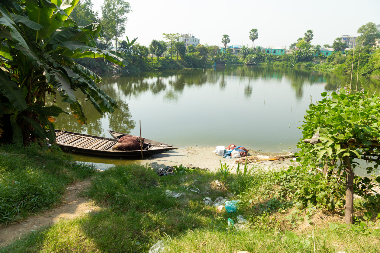 A vantage point on a lake, surrounded by trees, demonstrating fashion's water scarcity challenges.