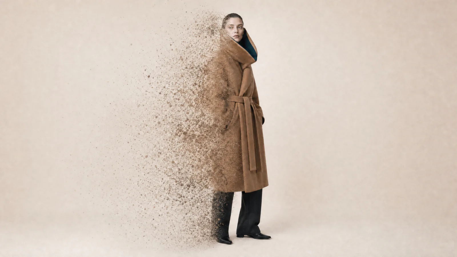 Full-length illustration of a model in a camel coat dissolving into particles.